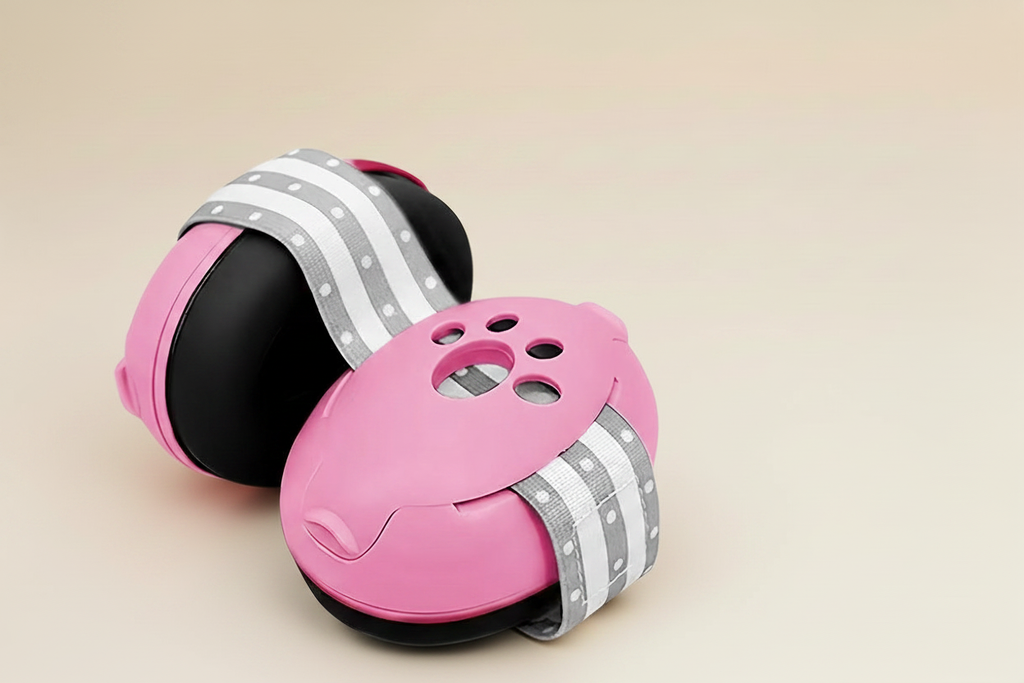 Little Nestlings Pink Baby Ear Muffs on Cream Background