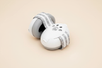 Little Nestlings White Baby Ear Muffs on Cream Background